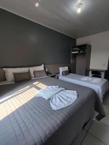 Postel nebo postele na pokoji v ubytování PORTAL PARQUE HOTEL