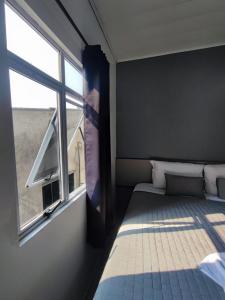 Postel nebo postele na pokoji v ubytování PORTAL PARQUE HOTEL