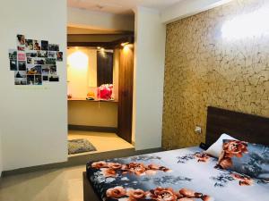 Postel nebo postele na pokoji v ubytování GRT Residency Hotel