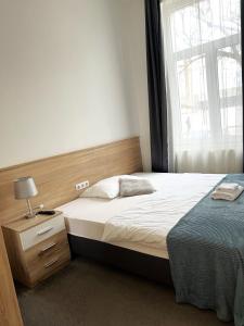 Posteľ alebo postele v izbe v ubytovaní Star Apartment 2