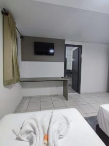 Postel nebo postele na pokoji v ubytování PORTAL PARQUE HOTEL