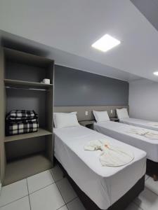Postel nebo postele na pokoji v ubytování PORTAL PARQUE HOTEL