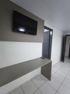 TV a/nebo společenská místnost v ubytování PORTAL PARQUE HOTEL