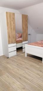 a room with two beds and a mirror at Ferienwohnung Kreuder in Bergisch Gladbach