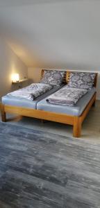 a bed in a room with two bedsitures at Ferienwohnung Kreuder in Bergisch Gladbach