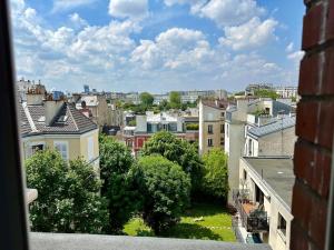 a view of a city from a balcony at Idéal pour visiter Paris in Saint-Mandé