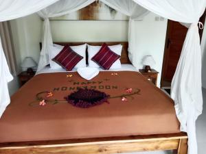 Buntera Homestay Sidemen客房内的一张或多张床位