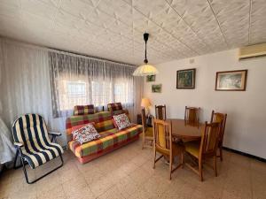 a living room with a couch and a table at Costa Cunit in Cunit