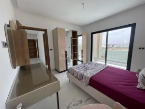Ένα ή περισσότερα κρεβάτια σε δωμάτιο στο Location saisonniere Villa a Sousse