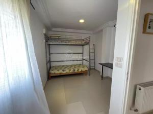 Katil atau katil-katil dalam bilik di Location saisonniere Appartement Tantana