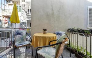 a patio with a table and chairs on a balcony at Amazing Apartment In Vodice in Vodice