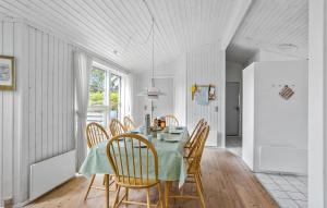 a dining room with a table and chairs at Beautiful Home In Tranekær With Wifi in Tranekær