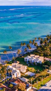 an aerial view of a beach with houses and the ocean at Bangalôs de Peroba in Maragogi