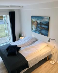 Postel nebo postele na pokoji v ubytování Skovly + 7 fotografií