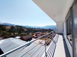 a balcony with a view of the mountains at Sr de Huanca in Mollepata