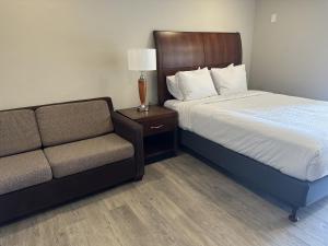 Voodi või voodid majutusasutuse The GQ Extended Stay toas