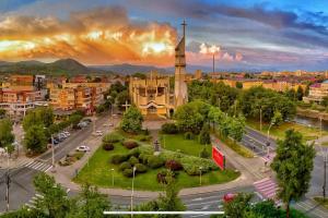 a view of a city with a church and a street at Eagle's Nest by Short-Stay in Baia Mare
