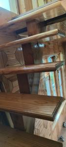 a wooden ceiling in a building with wooden beams at Hercue's Hillside Homestay in Shirir