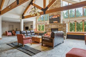 a living room with couches and a fireplace at Cozy Ski-In Ski-Out Condo with Heated Pool in Keystone
