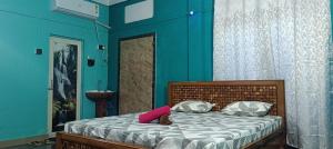 A bed or beds in a room at Move inn Sivsagar