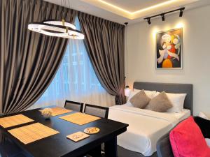 Posezení v ubytování LoFF Suite 2 Bedroom at Kuching Riverine Resort