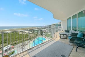 a balcony with a view of the beach and the ocean at Caribe D-1214 in Orange Beach +42 photos