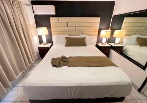 Postel nebo postele na pokoji v ubytování Hotel Guillen
