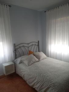 En eller flere senge i et værelse på Lugar de Figaredo