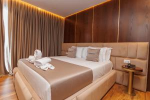 Postel nebo postele na pokoji v ubytování Harmony Boutique Hotel + 37 fotografií