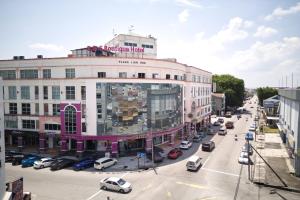 a city street with cars parked in front of a building at B&S Boutique Hotel in Batu Pahat