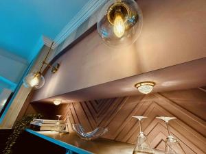 a room with a table with wine glasses and lights at Lot54 Deluxe Apartements in Neidenbach +90 photos