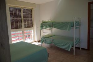 A bed or beds in a room at Casa Vacanze Sergio