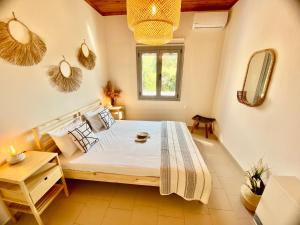a bedroom with a large bed in a room at Villa Elena - Private Villa in the heart of nature in Chania Town +58 photos
