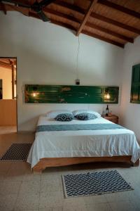 Postel nebo postele na pokoji v ubytování EcoHotel Casa Maria Parda