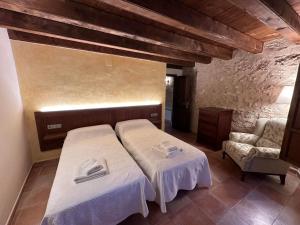 Postel nebo postele na pokoji v ubytování Casa Morató