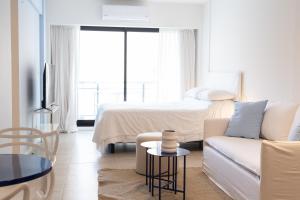 Ένα ή περισσότερα κρεβάτια σε δωμάτιο στο Mirto Beautiful Suite +26 φωτογραφίες