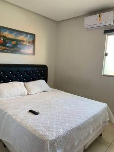 Postel nebo postele na pokoji v ubytování Kitnet 102, confortável, central, com ar, tv smart