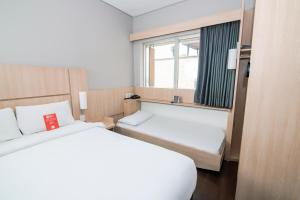 Postel nebo postele na pokoji v ubytování ibis Medellin