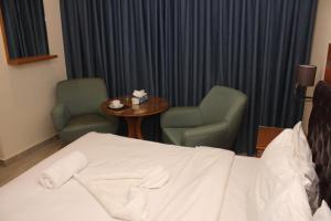Kama o mga kama sa kuwarto sa Jawheret Alswefia Hotel Suite