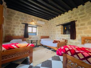 Postel nebo postele na pokoji v ubytování Zad Elmosafer Villa - Tunis Village + 37 fotografií