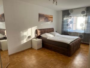a small bedroom with a bed and a window at Ferienwohnung Petry in Clausen