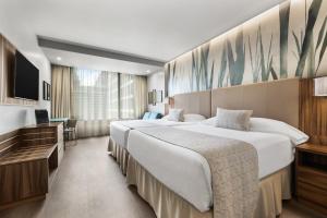 Riu Plaza Chicago客房内的一张或多张床位