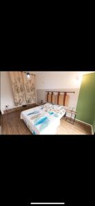 a bedroom with a large bed in a room at VILLA DAR EMNA in Hanshīr Qaşr Ghallāb