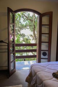 Katil atau katil-katil dalam bilik di Casa com Piscina e Área Gourmet em Mury
