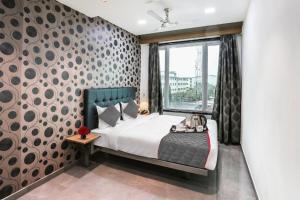 Postel nebo postele na pokoji v ubytování Glitz Hotels Arc Palace - Mankoli, Bhiwandi