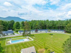 an aerial view of a large yard with a pool at Aspen at Manchester in Manchester