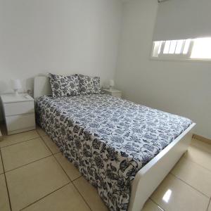A bed or beds in a room at My Little Bungalow