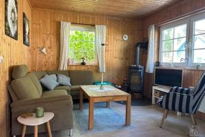 Posezení v ubytování Ferienhaus Reet am Useriner See