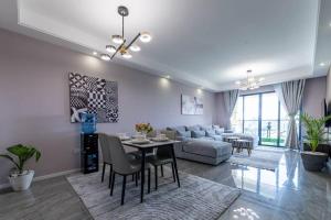 a living room with a table and a couch at Kilimani Premier 1BR in Nairobi