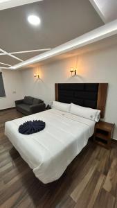 Postel nebo postele na pokoji v ubytování Hotel ANB Aeropuerto Guadalajara